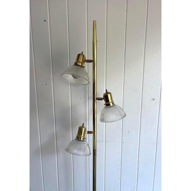 1960s-70s brass glass-dome 3-light floor lamp. Excellent condition. Measurements 65.5" tall 6.5" diameter of light domes...