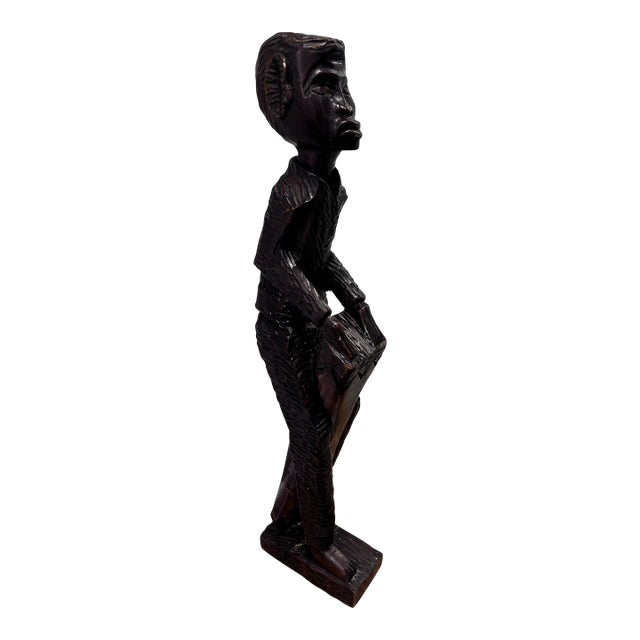 Vintage Hand-Carved Wooden African Tribal Figurine Depicting a Man Playing a Drum, Crafted From Dense Hardwoods Like Ebony For Sale