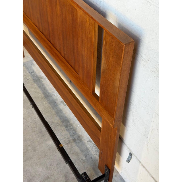 This exceptional vintage bedframe features a beautifully balanced geometric form with subtle negative space cutouts...