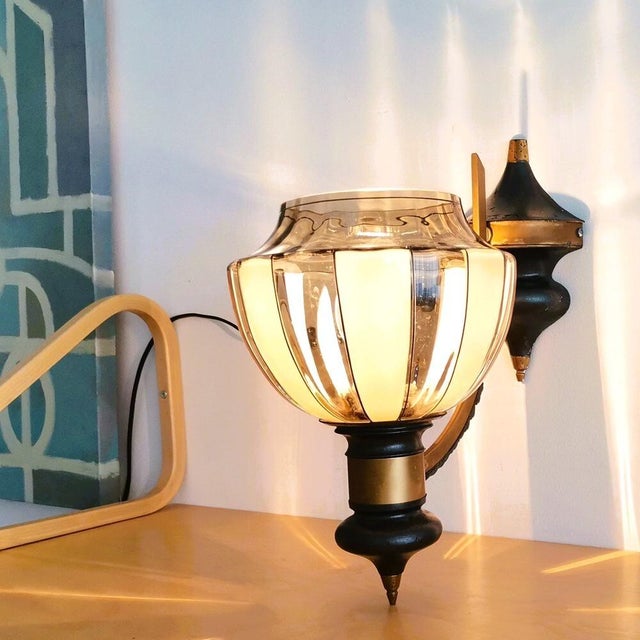 This wall sconce was made in the 1990s in Portugal, in style of Art Deco. It is made of metal, and equipped with a smoked...