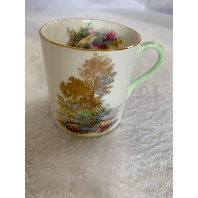 Shelley English Bone China Heather tea cup with matching saucer circa 1962-1963. The tea cup pattern features a wooded...