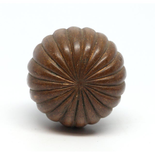 Radial fluted cast bronze knob with a spindle that is permanently secure. The manufacturer and date of creation is...