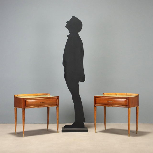 Pair of 1950s nightstands, featuring a sleek and functional design. Made of veneered wood with exotic essences, they have...