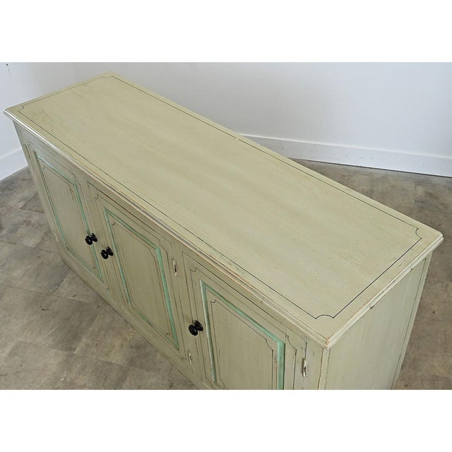 A pair of solid pine English sideboards or buffets has been updated with colorful painted exteriors. The finish is painted...