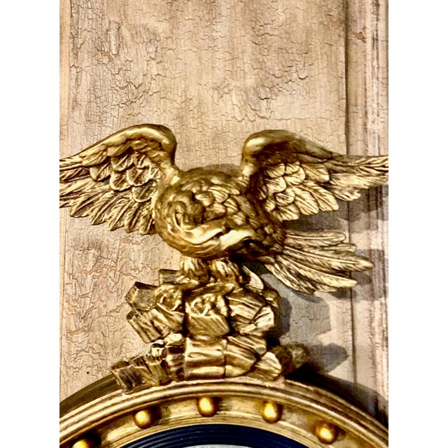 This is a fine example of a period Regency Carved Giltwood Eagle surmounted mirror. The mirror displays a wonderful...