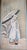 This Japanese ukiyo-e artwork depicts a young woman walking in the snow, created by the Edo-period artist Isoda Koryūsai....