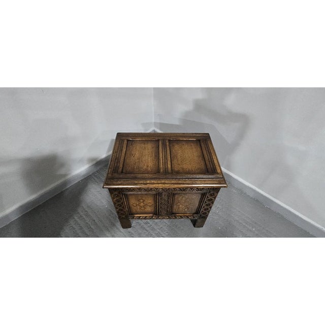 A tiny carved oak two panel oak coffer with inlay detailing to the front, excellent colour and condition. 21" high 24"x 17"