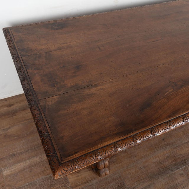 19th century Italian monastery table, crafted in walnut with a beautiful aged patina. The table features a dramatic carved...