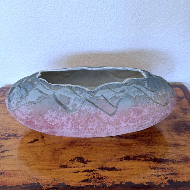 Large pink and blue raku centerpiece bowl. Done in the traditional raku style by famed American artist Tony Evans. Signed...