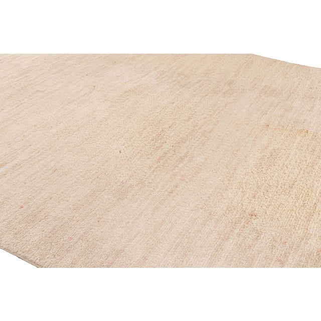 Handmade in wool and originating from Morocco circa 1950-1960, this 9x12 vintage Moroccan rug is an especially rare large-...