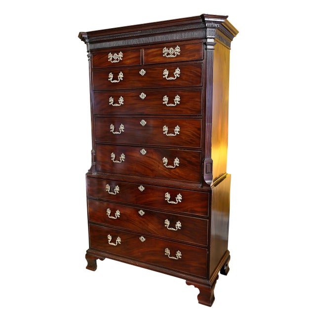 With detachable rectangular cornice with fluting and dentilled carving and gadrooning with canted corners over a...