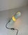 Beautiful space age table lamp made of white abs plastic, with a distinctive cylindrical, capsule-shaped body and an...