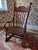 Offering a patina-rich child's rocking chair, dating from the late 19th to early 20th century. Turn of the century...
