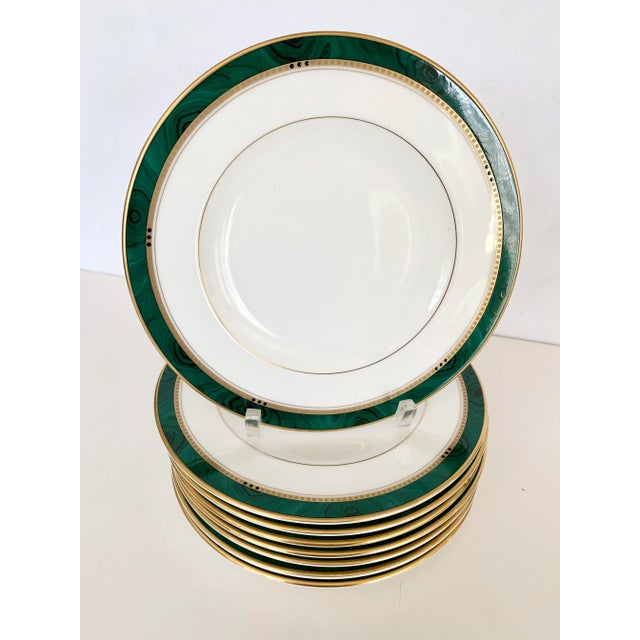 The richness of the green malachite pattern plays beautifully off of the crisp white bone china coupled with a gold trim...