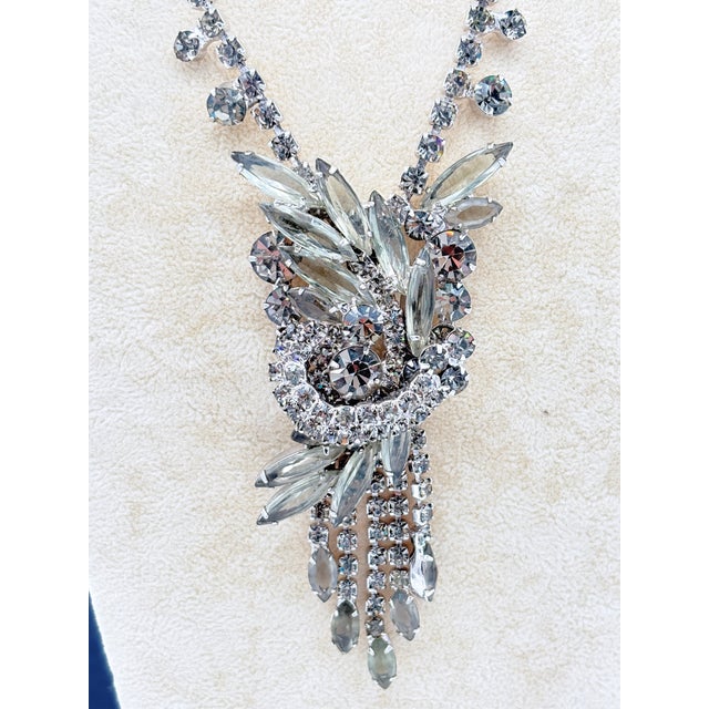 Offered is a vintage rhinestone necklace and bracelet set attributed to DeLizza & Elster (Juliana). Both pieces display...