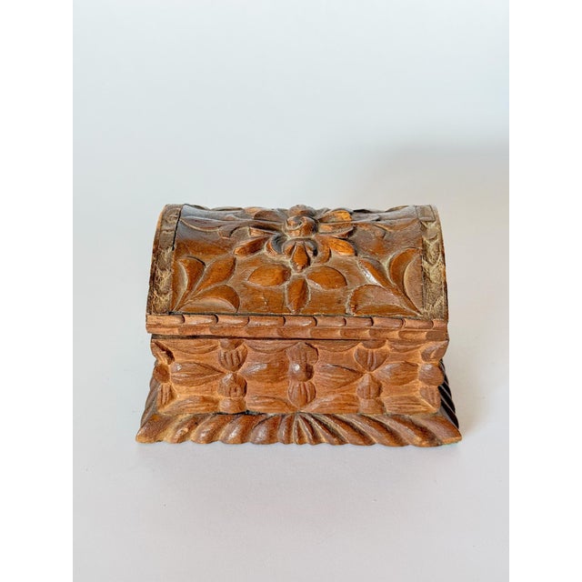 Stunning vintage carved wood casket box with intricate deep relief flowers and leaf patterns carved into all sides....