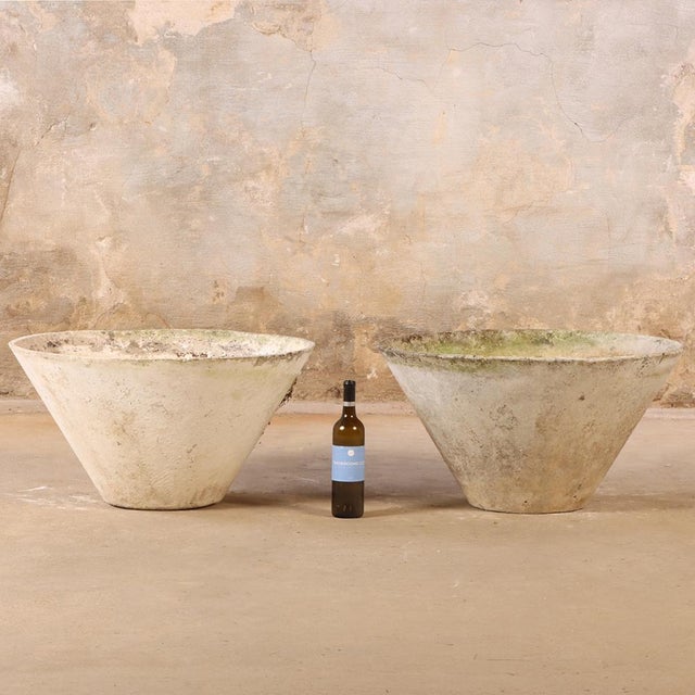 A stunning pair of hard-to-find models, these French cast stone round planters are attributed to Willy Guhl (1915–2004),...