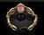 Exuding timeless mid-century glamour, this vintage gold-tone bracelet showcases a luminous marquise-shaped center cabochon...