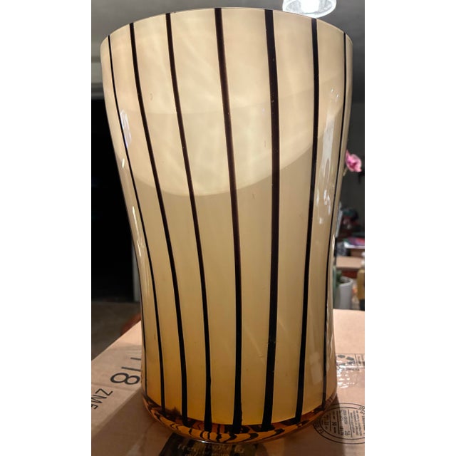 The large vase showcases the art nouveau style reminiscent of Loetz Tango glass. The orange and black color combination is...