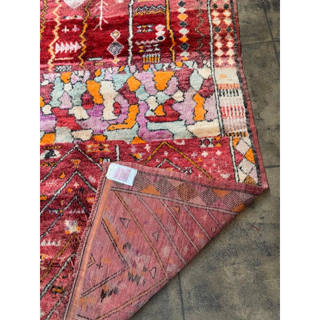 A rare and visually striking handwoven Moroccan wool rug showcasing bold Art Deco influence through its rhythmic geometric...