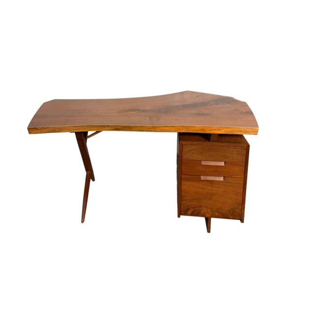 This custom made Conoid desk by the Nakashima factory is an exquisite example of George Nakashima's brilliance of natural...