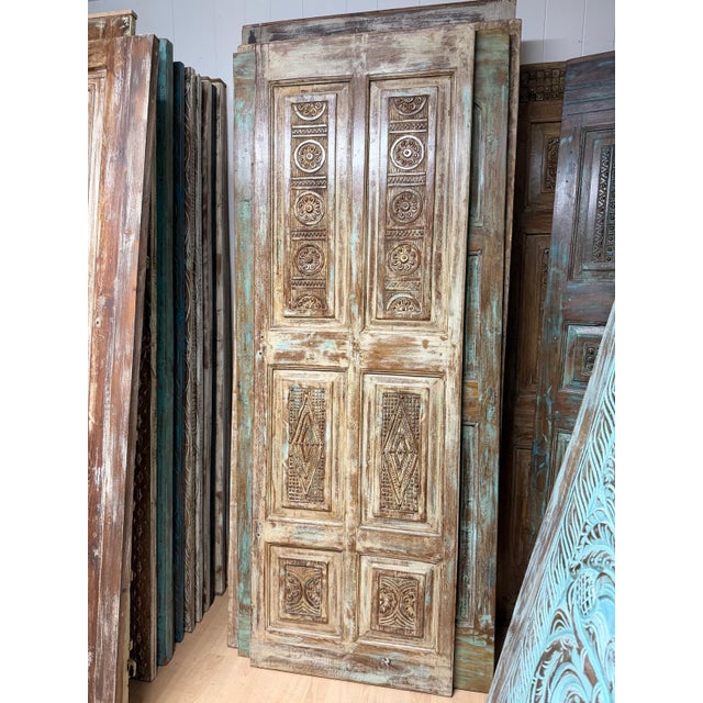 Make a bold architectural statement with this antique carved wood barn door, beautifully handcrafted with intricate floral...