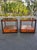 Mid-century modern side tables with smoked inset glass. In the style of John Keal for Saltman Brown. A sleek pair with a...