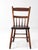 Antique primitive plank seat chair featuring a simple spindle back, gently curved rails, and slender turned legs. Rich...