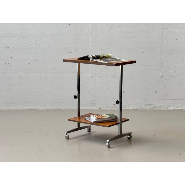 This functional side table combines understated industrial aesthetics with the warm appeal of wood and is a prime example...