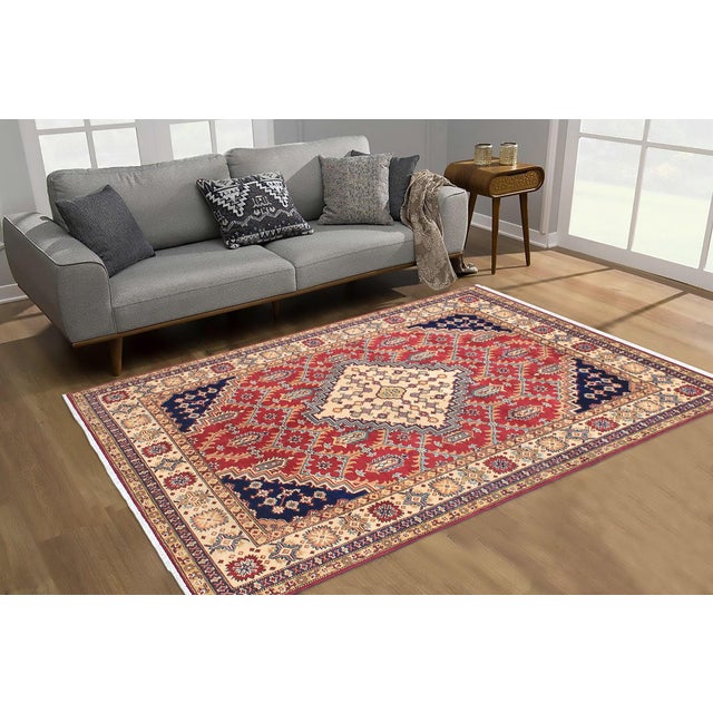 Enhance your home with this exquisite hand-knotted Kazak rug, crafted from fine hand-spun wool and dyed with all-natural...
