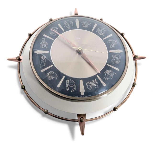 This mid century wall clock, the Metamec Vintage Zodiac Copper Starburst Design, brings timeless style and precise...