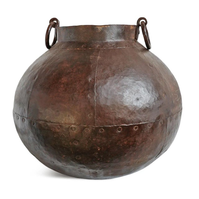Authentic vintage India iron water pot with ring handles at top. Beautiful aged patina.