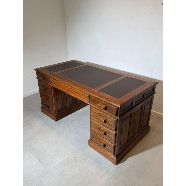 Elegant antique double-sided executive desk crafted in beautiful elm wood. The warm grain of the elm gives the desk a...
