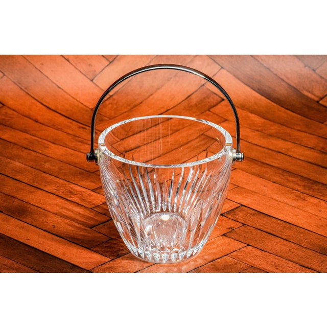 Add an air of classic sophistication to your barware collection with this stunning Baccarat crystal ice bucket. Crafted...