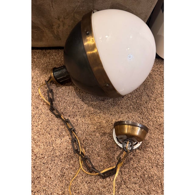 The Large Pendant in Bronze is a stylish and elegant lighting fixture perfect for indoor spaces. With its antique design...