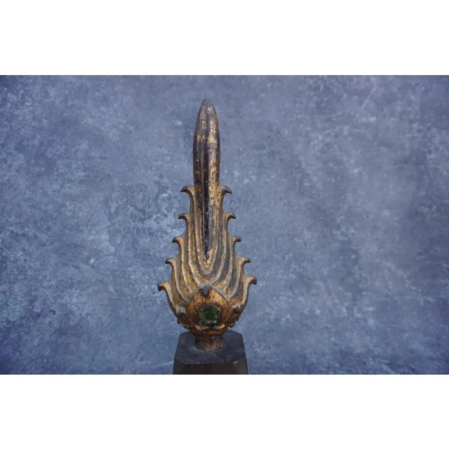Measures 15" tall x 4" wide x 4" deep. The flame placed on the top of the Buddha’s head is called Siraspata, signifying...