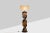 Varnished wooden lamp base, sculptural and abstract in shape, ending in a decorative ball at the top. 1970s. This piece is...