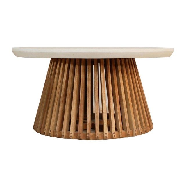 Crafted for both durability and design, the Azure Coffee Table pairs a smooth cement top with a striking plantation teak...