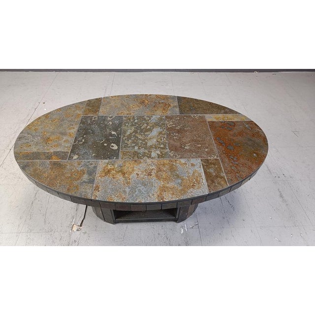 Vintage oval brutalist stone coffee table. Beautifully tiled stones with gorgeous brown/green/beige colours. 1970s -...