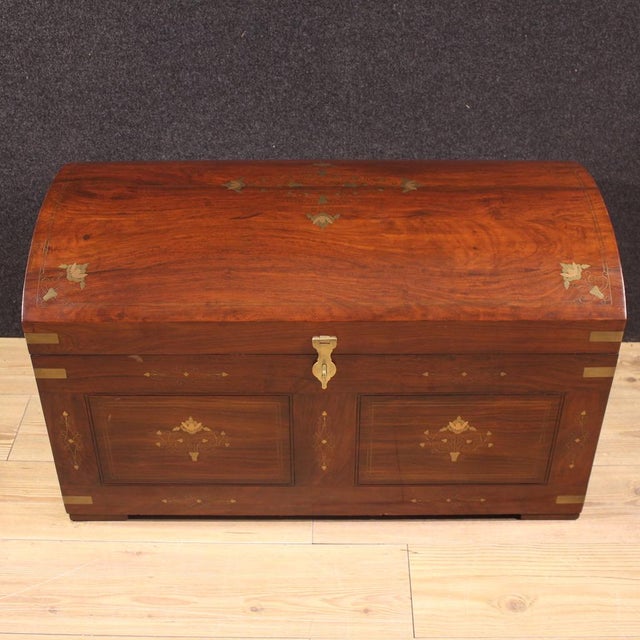 French trunk from the mid-20th century. Crafted from high-quality mahogany with geometric and floral decorations in gilded...