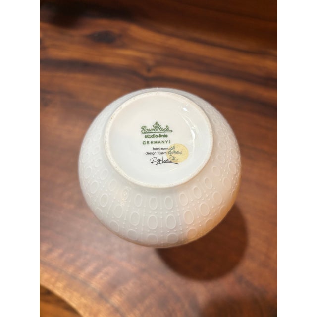 Ivory glazed porcelain vase with narrow neck designed by Bjorn Wiinblad for Rosenthal Part of the Romanze/Romance...