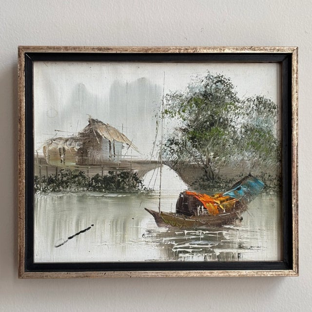 Offering a lovely mid-20th century oil on canvas Asian impressionist painting of a junk boat by the shore. Love how this...