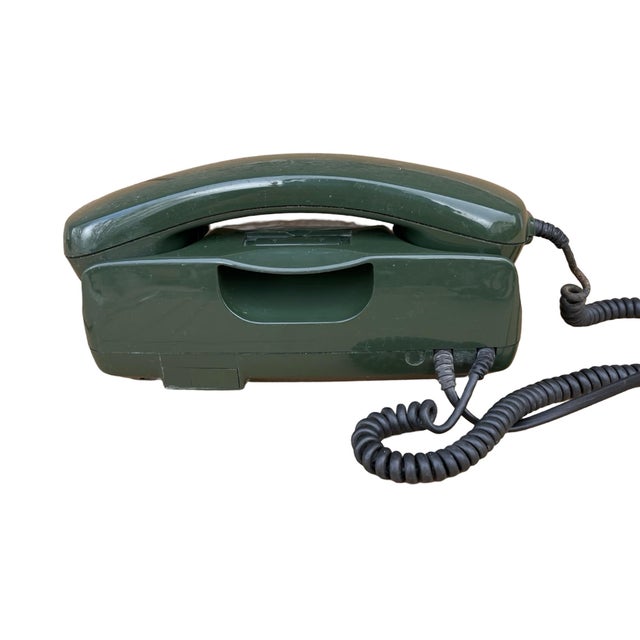 German landline telephone type POST FETAP 751-1 manufactured in 1990 by Alpha Ferooquick. Item made of green plastic, with...