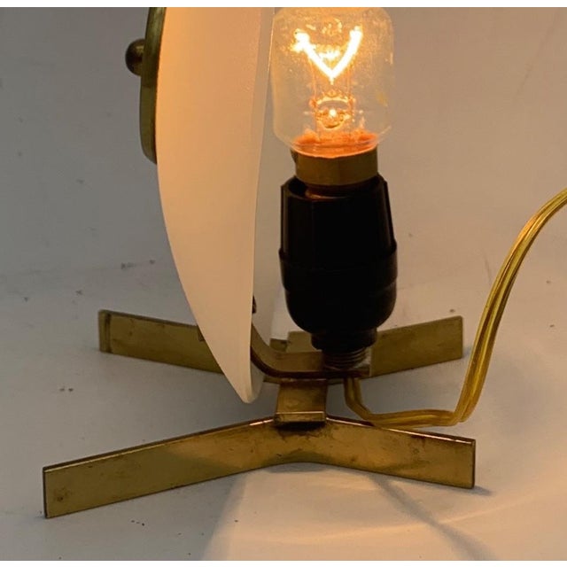 Single table lamp from around 1950. The lamp is equipped with an E14 socket. The electrical system is new and in working...