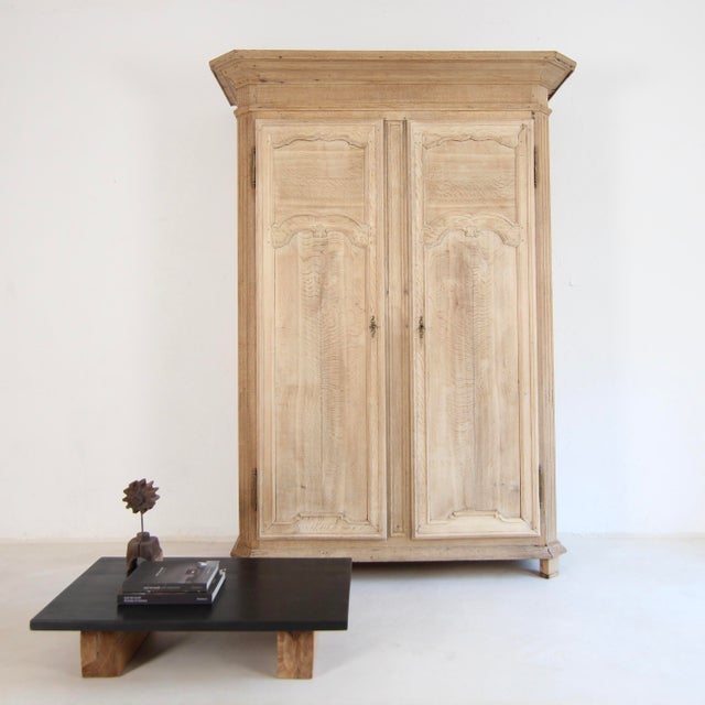 A large Belgian provincial hall cupboard or wardrobe from the first half of the 19th century. Solidly crafted from oak....