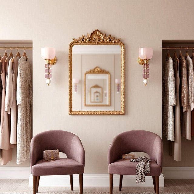 Pair of mid-century modern Murano glass wall sconces, Italy circa 1990s. The pair of Italian sconces is made of pale pink...