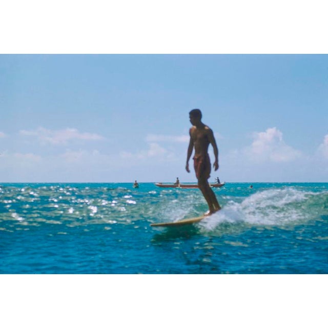 Hawaiian Scenes by Toni Frissell A surfer rides a wave, Hawaii, 1957. (Photo by Toni Frissell) 16x20" inches / 40x50cm...