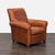 This Ethan Allen lounge chair features rich brown leather with a timeless, classic design. It has supportive rolled arms...