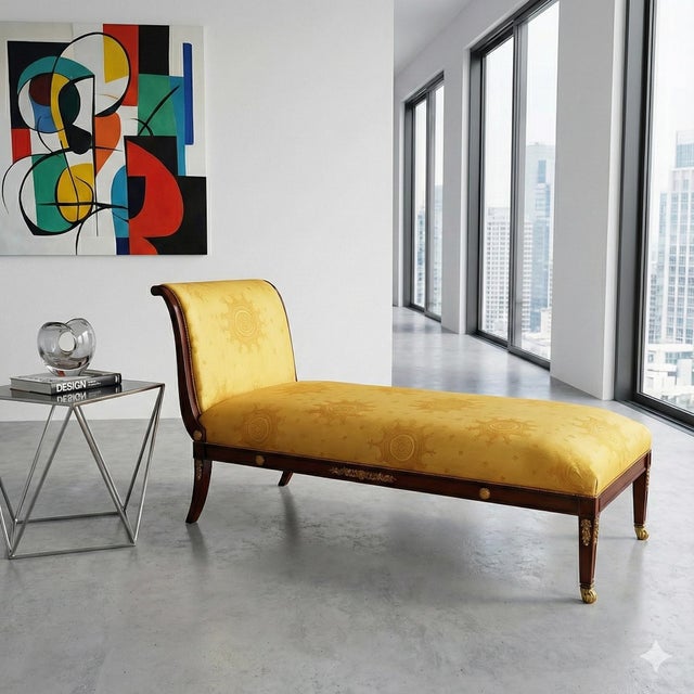 This is a handsome mid-century French Empire style mahogany chaise lounge. Th frame is mahogany with heavy ormolu adorning...