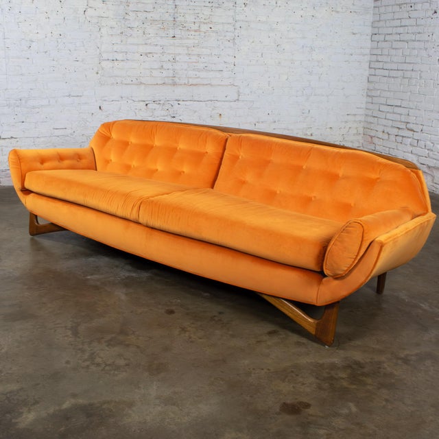 Gorgeous vintage MCM or Mid Century Modern Adrian Pearsall Style Gondola Sofa composed of sculptured wood front legs,...